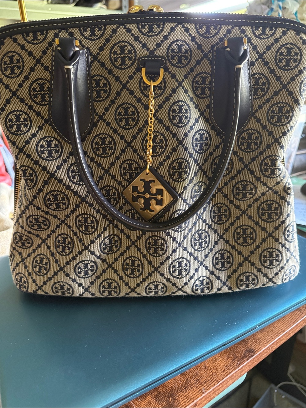 Tory Burch T-Monogram Swing  Bag. Beige Canvas Logo Tote w Black Trim Gold Charm